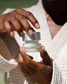 Advanced repair eye cream jar being opened