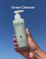 Video demonstrating Ocean Cleanser application, lathering into a creamy foam and rinsing to reveal refreshed, radiant skin