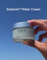 Video demonstrating Seabiotic® Water Cream transforming from a lightweight gel into a refreshing water-burst texture as it’s smoothed onto skin for a dewy glow