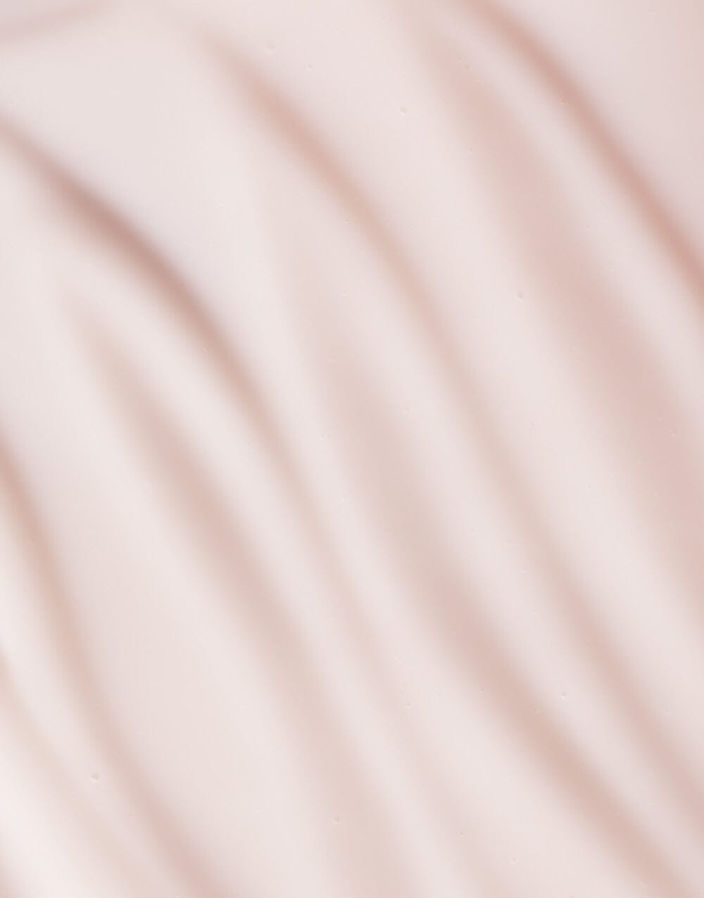 Macro texture of Seaglow Serum in soft wavy lines and creamy finish