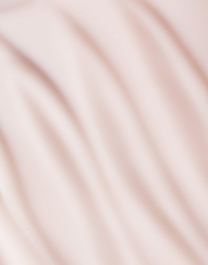 Macro texture of Seaglow Serum in soft wavy lines and creamy finish