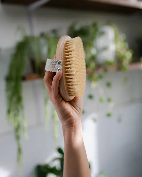 A Person Holding A Natural Bristle Brush