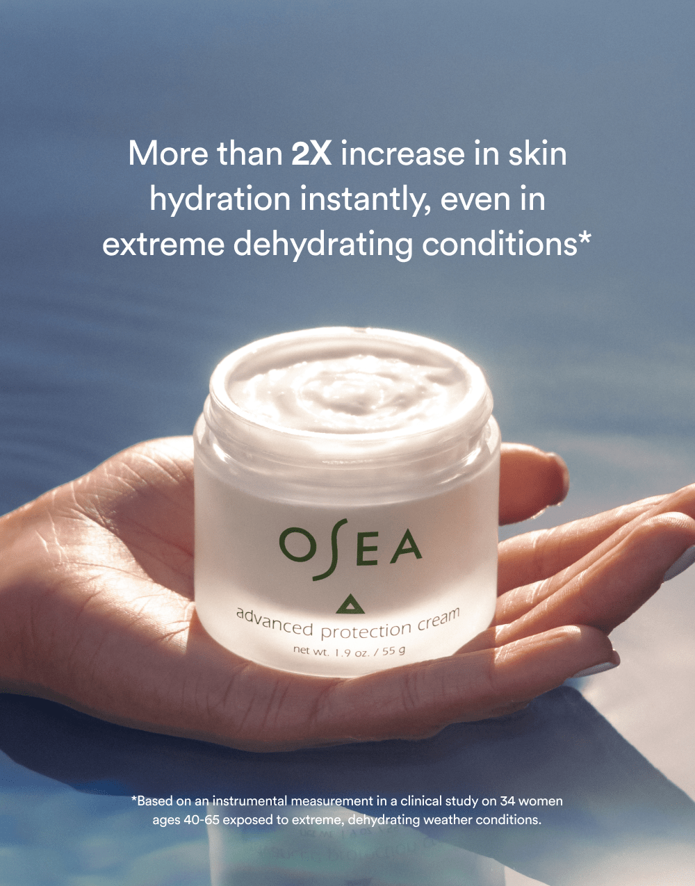 Open jar of OSEA Advanced Protection Cream held in hands with clinical benefit card behind